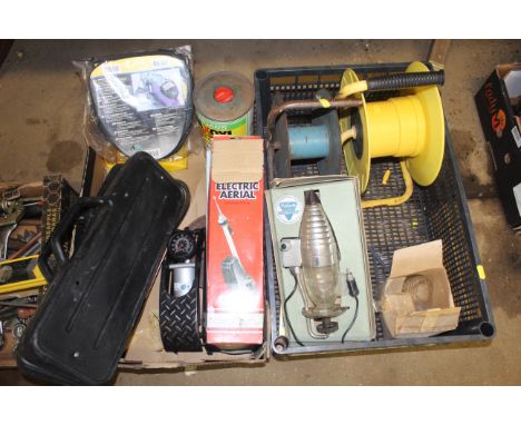 Two boxes of various items to include three electric car aerials all in original boxes; a single cylinder foot pump; a motor 