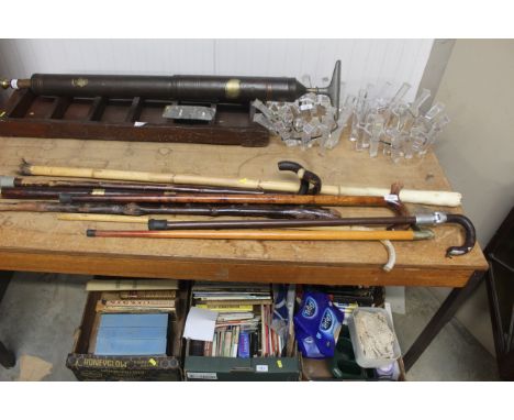 A quantity of various walking sticks, shooting stick etc.