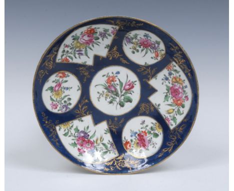 A Worcester Fan pattern saucer dish, painted with colourful garlands of flowers in fan shaped cartouches,  flanked by smaller