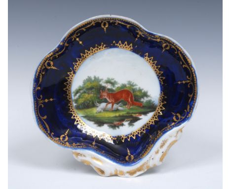 A Worcester Fable shell shaped dish, painted by Jeffreyes Hamett O'Neale, with The Fox and the Sheep, the fox standing over t