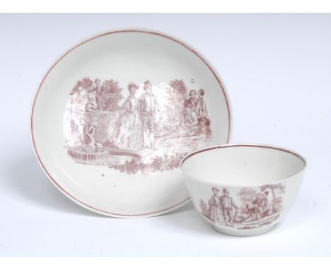 A Worcester La Cascade pattern tea bowl and saucer, scratched cross type, printed after a painting by Antoine Watteau, engrav