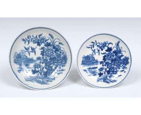 A Worcester Fence pattern saucer, printed in underglaze blue with fence, chrysanthemums and two birds in flight, tram line bo