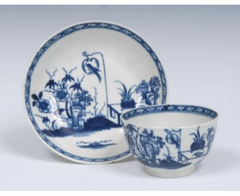 A Worcester Bird in a Ring pattern tea bowl and saucer, well painted with a singing bird sitting in a fancy ring near a table