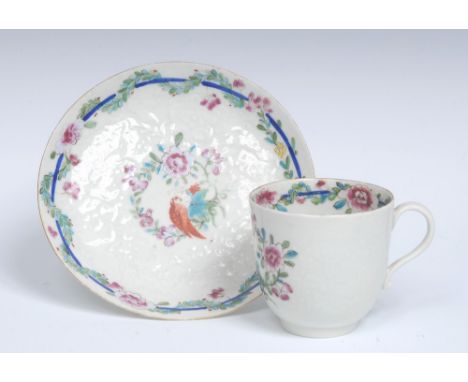 A Worcester Chrysanthemum moulded Old Worcester Parrot pattern coffee cup and saucer, painted by Giles in famille rose palett