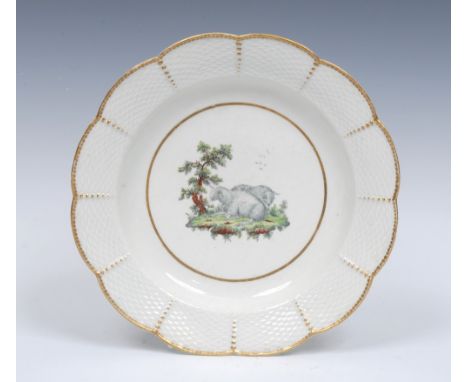 A Worcester Fable shaped circular plate, ozier-moulded rim,  painted in the centre with a landscape vignette with two reclini