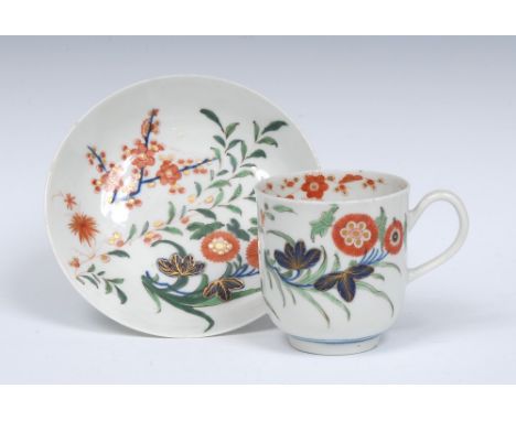 A Worcester coffee cup and saucer, grooved handle, decorated in the Imari palette, with `Kempthorne' style with  flowering pr