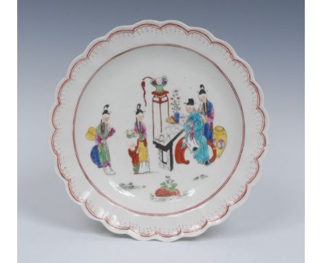 A  Worcester Chinese Family pattern shaped circular plate, decorated in polychrome with oriental figures and attendants by an