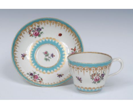 A  Worcester double ogee shaped cup and saucer, entwined handle, painted in the James Giles atelier, with  richly gilded C sc