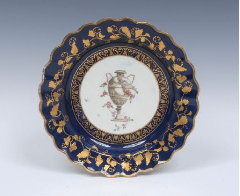 A Worcester scalloped dessert plate, decorated in the workshop of James Giles, painted in the centre with a classical urn, dr