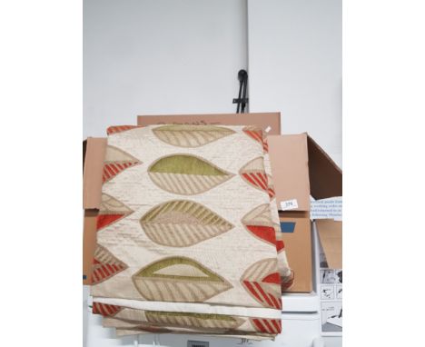 A BOX CONTAINING CURTAINS