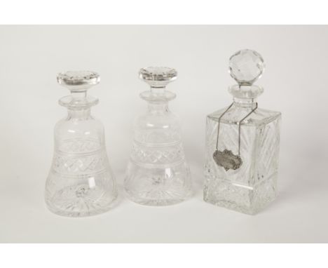 PAIR OF STUART CUT GLASS DECANTERS AND STOPPERS, each of bell form with flat topped stopper, 8 3/4" (22.3cm) high, TOGETHER W