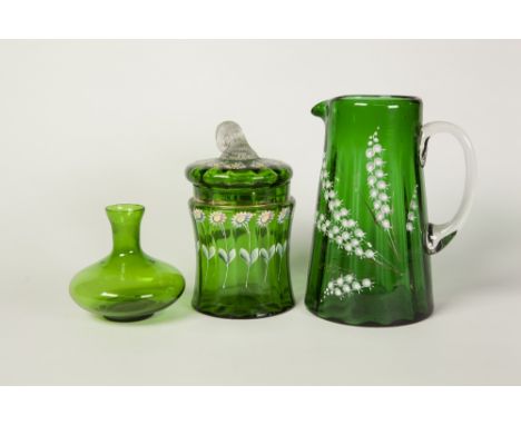 TWO PIECES OF VICTORIAN GREEN GLASS, enamelled with flowers, comprising a  TAPERING JUG, 7 1/4" (18.4cm) high, a WAISTED CYLI