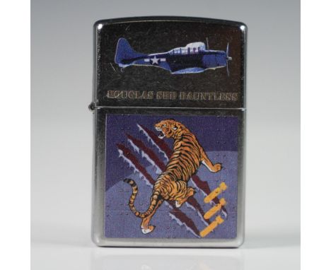 Official Zippo lighter featuring the Douglas SBD Dauntless, the celebrated U.S. Navy dive bomber used during World War II. Th
