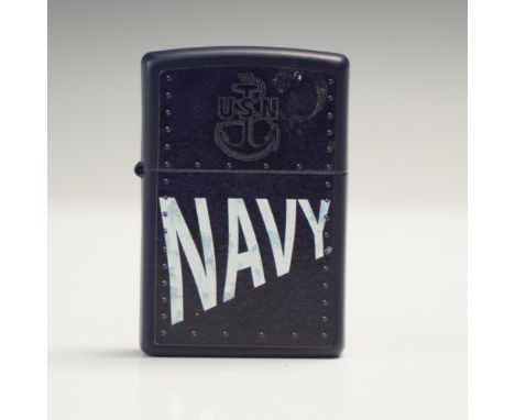 Genuine Zippo windproof lighter featuring a bold US Navy design with raised rivet-like detailing and the USN insignia on a ma