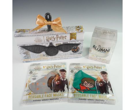 Collection of four officially licensed Wizarding World Harry Potter-themed items. Includes a boxed Golden Snitch cookie skill
