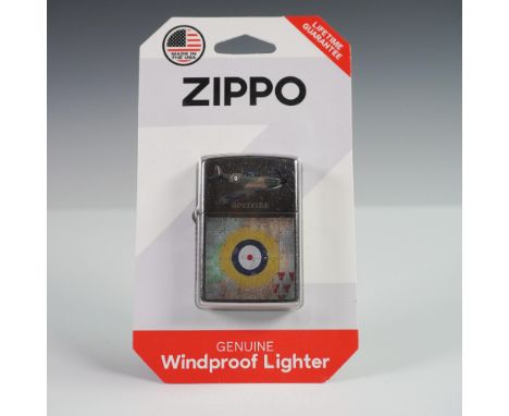 Zippo windproof lighter featuring a detailed image of the iconic British Spitfire fighter plane along with a vintage-style ta