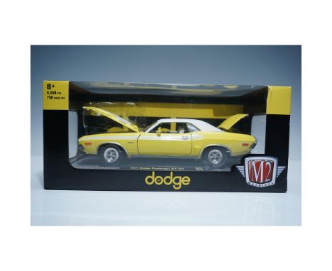 Presented is a M2 Machines 1:24 scale die-cast model of the 1971 Dodge Challenger R/T 383, finished in vibrant yellow with a 