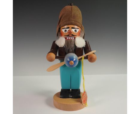 A hand-crafted wooden nutcracker figure by Steinbach, representing an aviator pilot. Produced in Germany by the renowned Stei