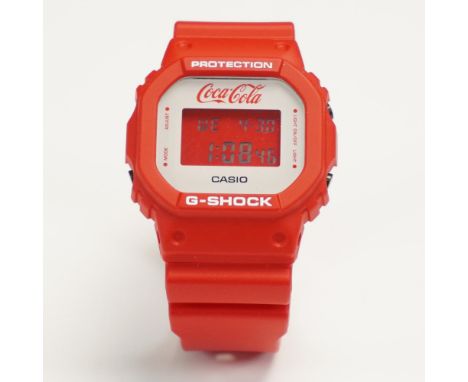 Vibrant red Casio G-Shock DW-5600VT digital wristwatch created in collaboration with Coca-Cola. This limited edition model fe