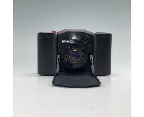 Vintage Minox compact film camera with a collapsible lens design, crafted by the renowned German brand Minox, known for its p