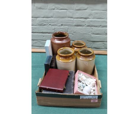 Four stoneware jars plus a selection of white metal cased cutlery, ceramic thimbles and a miniature tea set