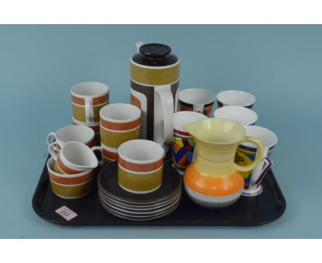 Five Clarice Cliff style Wrenn gift ware cups, a Shelley jug plus a Meakin Studio ware coffee pot, six cups and saucers, milk