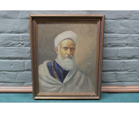 A framed oil portrait on canvas of a Moroccan gentleman, indistinctly signed, 40cm x 30cm