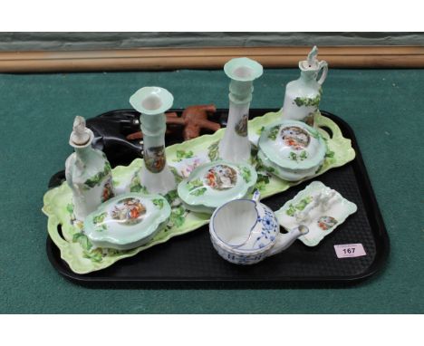 A vintage continental porcelain dressing table set (a few chips and ring tray as found), plus elephants etc