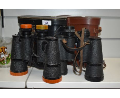 Two pairs of vintage binoculars, Cumbria Deluxe and Denhill Deluxe, with leather cases