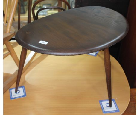 A dark elm Ercol single pebble table, height 40cm, width 66cm.  Condition: no signs of any damage, minor scuffs to outer edge