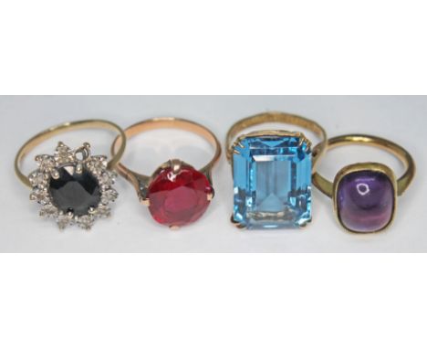 A group of four rings comprising a hallmarked 9ct gold sapphire and diamond cluster ring, a synthetic ruby ring unmarked, a h