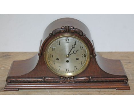 A Junghans steel dial West Minster chime mantle clock in carved oak case, length 53cm, height 28cm.  Condition: comes with pe