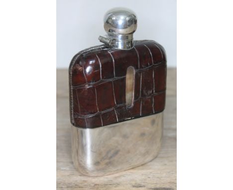 A silver plated croc leather bound glass hip flask, height 15cm.  