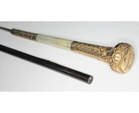 A sword stick with yellow metal and mother of pearl handle, blade length 68cm, total length 93cm.  Condition: some surface we