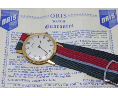 A vintage gold plated Oris wristwatch having signed dial with Roman numerals and baton hands in black, the 32mm round case wi