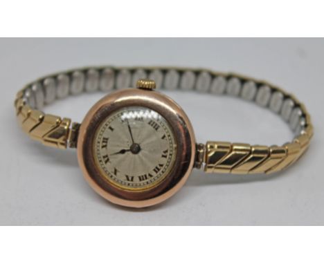 A 1920s hallmarked 9ct gold Rolex ladies wristwatch with unsigned guilloche dial, Roman numerals and spade hands, 25mm round 