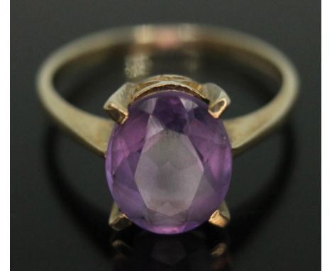 A hallmarked 9ct gold amethyst ring, the stone measuring approx. 10mm x 8mm x 3mm, gross wt. 2.11g, size K/L.  Condition - go