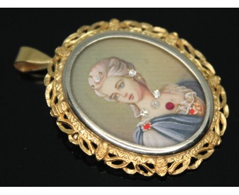 A portrait brooch, length 40mm, the loop marked '750' with UK import marks, gross wt. 6.04g.  