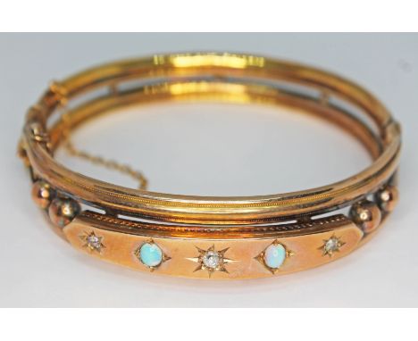 A late Victorian 9ct gold diamond and precious opal set bangle, Birmingham 1897, diam. approx. 5.5cm, gross wt. 16.52g.  Cond