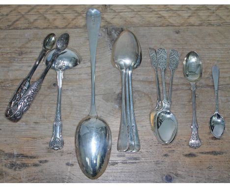 A mixed lot of silver flat ware including a basting spoon London 1901, three desert spoons London 1895, a pair of Victorian I