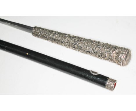 A sword stick with white metal top, blade length 53cm, total length 88cm.  Condition: general surface wear to metal mount and