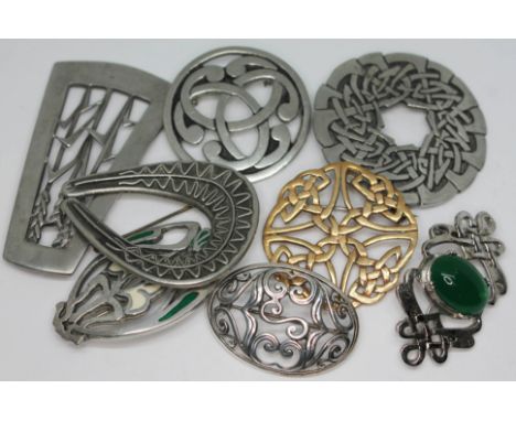 A group of eight brooches including Swedish, Celtic, silver and pewter etc.  