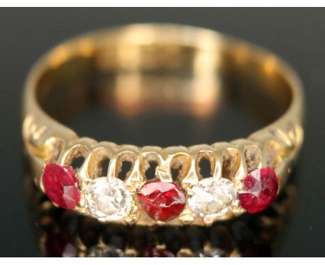 A hallmarked 18ct gold diamond and red stone ring, gross wt. 2.54g, size M.  Condition - conchoidal fracture to central stone