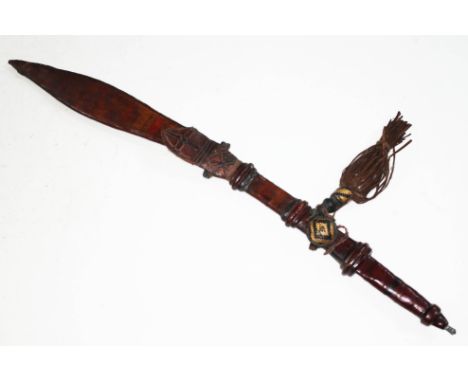 A kaskara with leeather scabbard and grip, blade length 50cm, total length 69cm.  Condition: various pitting and dings to bla