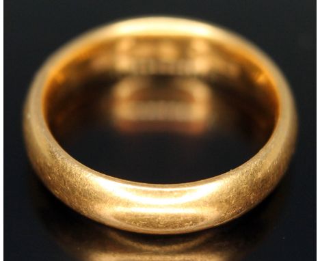 A hallmarked 22ct gold wedding band, wt. 6.47g, size K.  Condition - good, no damage repair, general wear only.