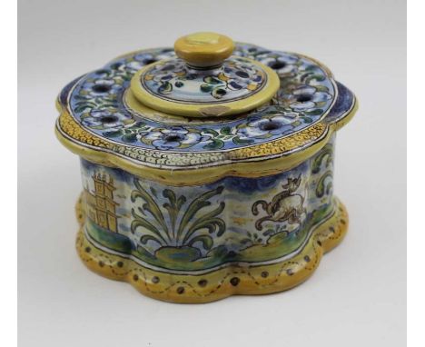 A 19th century Spanish tin glazed Faience earthenware table top inkwell, of lobed design, central well with lid surrounded by