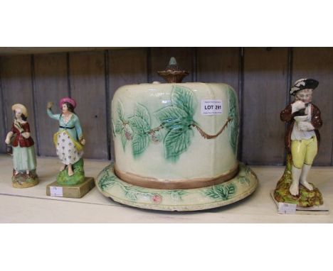 A late 19th century majolica cheese dome &amp; cover, together with three English ceramic figurines,c.1800