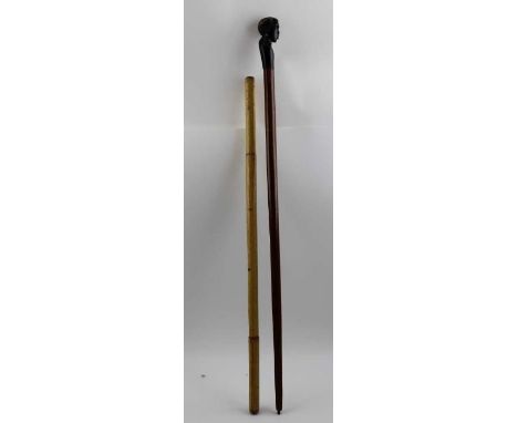 A military swagger stick, by repute used in Burma by a&nbsp; British Colour Sergeant, 60cm long, together with another stick 