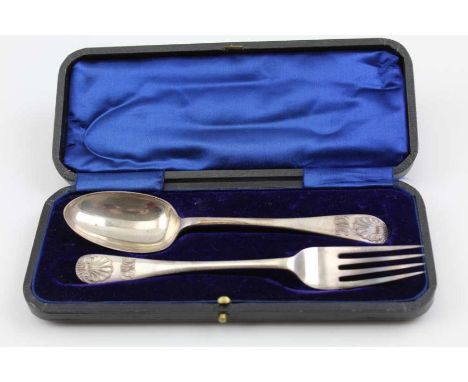 Henry Williamson Ltd. An early 20th century silver Christening set, comprising fork and spoon with scallop terminals to the h