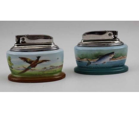 Two Minton table lighters, one decorated with a pheasant in flight, signed T.Lee, the other a leaping salmon, signed by A.Hol